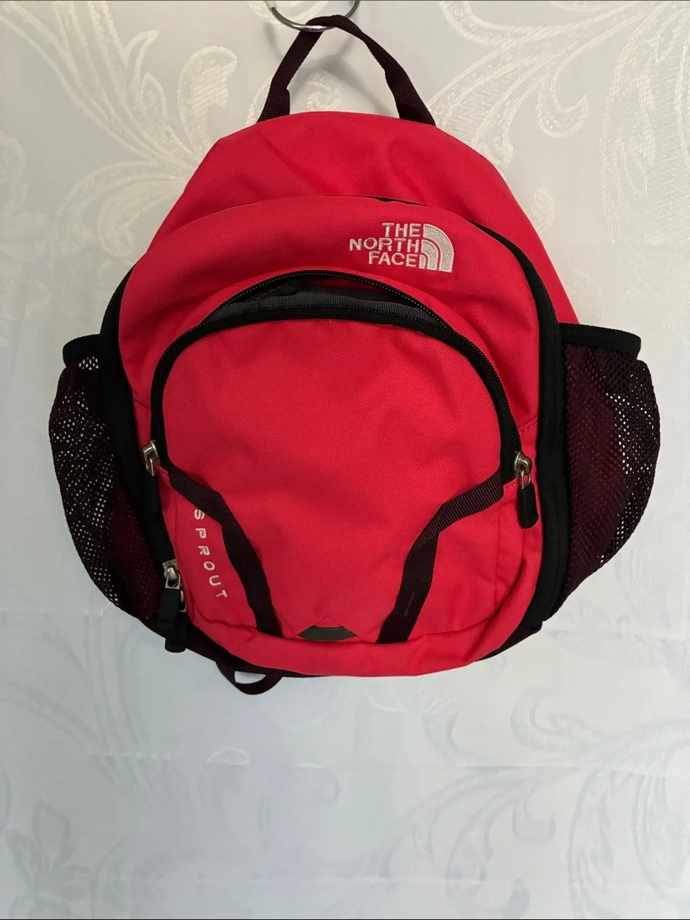 The North Face red and black Sprout backpack